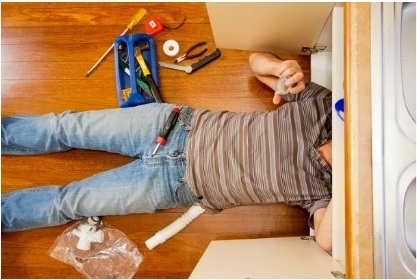 Handyman completing a home repair project
